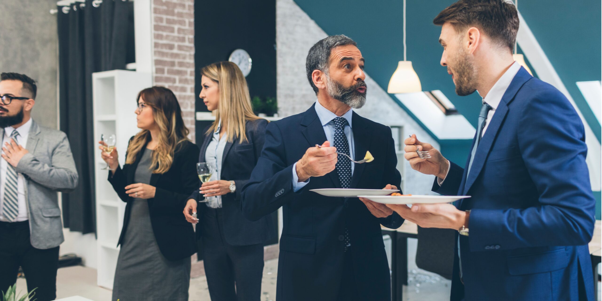people mingling at an event - law firm alumni relationships